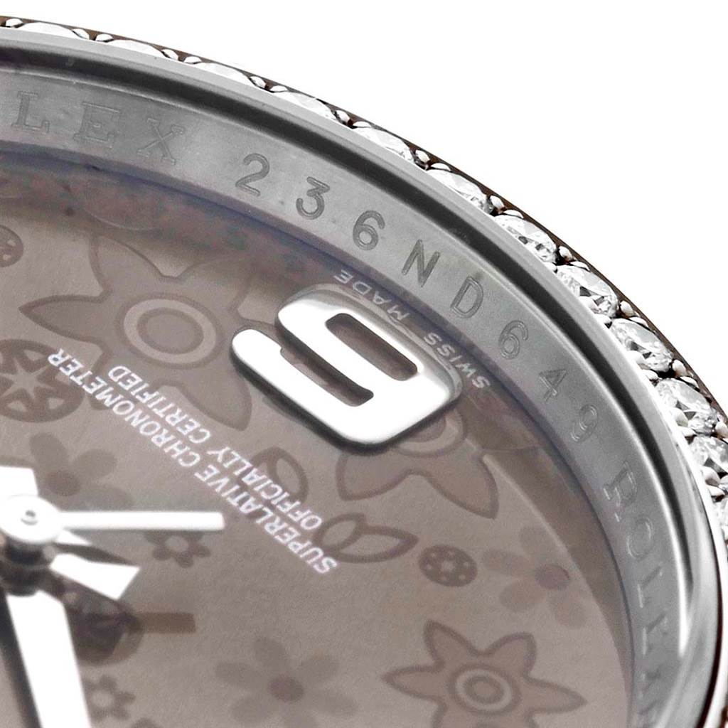 Close-up of the watch face and bezel of a Rolex Datejust 116244 Men's Stainless Steel Brown Dial 116244 Men's Stainless Steel Brown Dial model, showing details of the dial and edge.