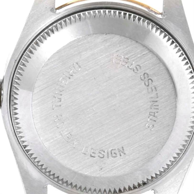 The image shows the back case of a Rolex Datejust 69173 Women's Stainless Steel Champagne Dial 69173 Women's Stainless Steel Champagne Dial watch, focusing on its stainless steel design and engravings.