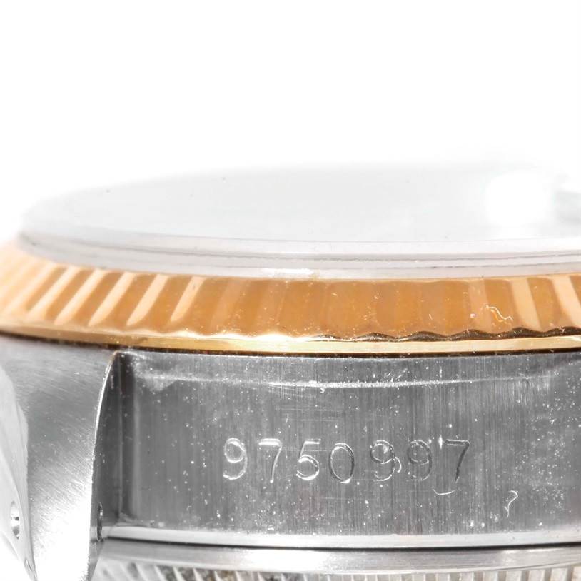 This image shows a close-up of the side of the case and bezel of a Rolex Datejust 69173 Women's Stainless Steel Champagne Dial 69173 Women's Stainless Steel Champagne Dial watch.