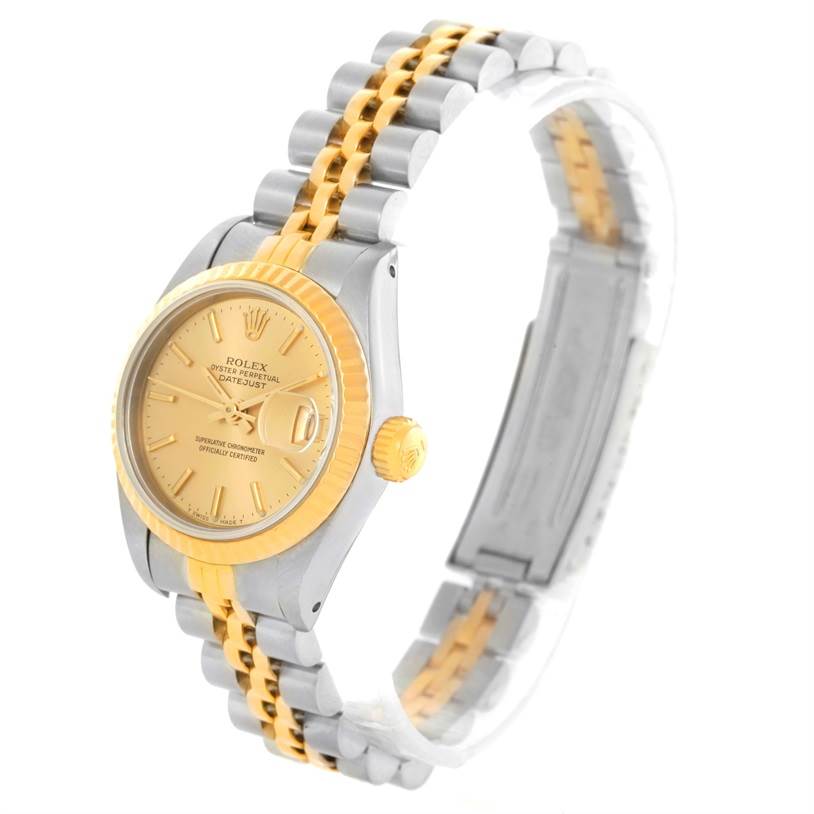 The image shows a Rolex Datejust 69173 Women's Stainless Steel Champagne Dial 69173 Women's Stainless Steel Champagne Dial watch angled from the front left side, highlighting its gold face, fluted bezel, and two-tone bracelet.