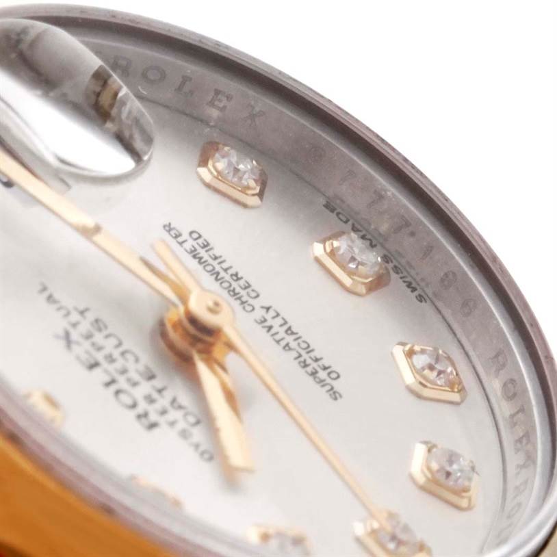 This image shows a close-up of the dial and part of the bezel of a Rolex Datejust 179163 Women's Steel and Gold (two tone) Silver Dial 179163 Women's Steel and Gold (two tone) Silver Dial watch, focusing on the diamonds and text.