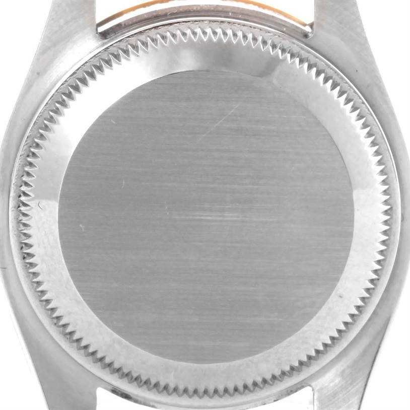 The image shows the back casing of the Rolex Datejust 179163 Women's Steel and Gold (two tone) Silver Dial 179163 Women's Steel and Gold (two tone) Silver Dial watch from a top-down angle.