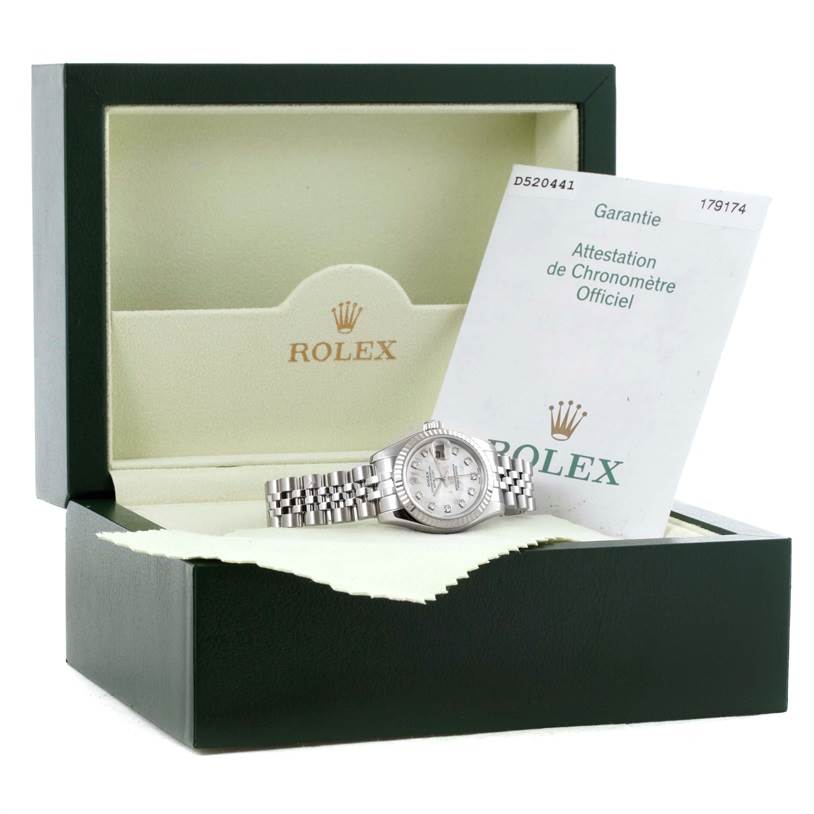 The image shows the Rolex Datejust 179174 Women's Stainless Steel Mother of Pearl Dial 179174 Women's Stainless Steel Mother of Pearl Dial watch in its box with the warranty card.