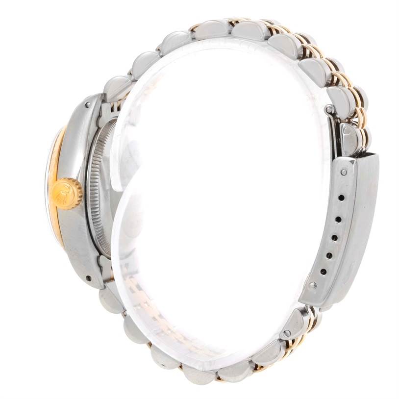 The image shows the side view of a Rolex Datejust 6917 Women's Stainless Steel Champagne Dial 6917 Women's Stainless Steel Champagne Dial watch, highlighting the crown, case, and part of the bracelet.