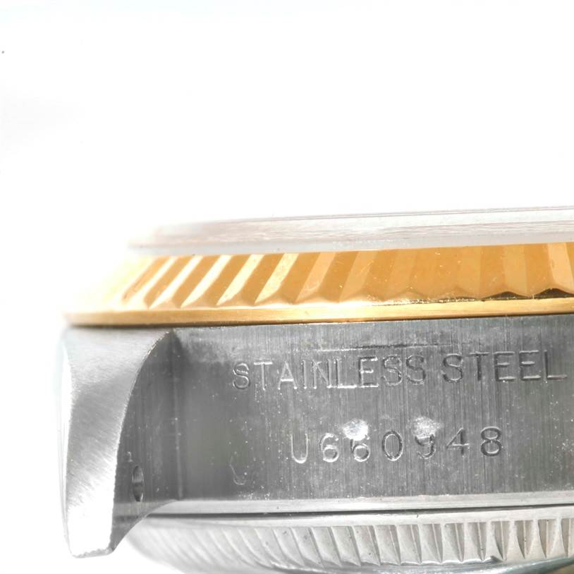 This close-up image of a Rolex Datejust 69173 Women
s Stainless Steel Black Dial 69173 Women
s Stainless Steel Black Dial watch shows part of the case and the fluted bezel from a side angle.