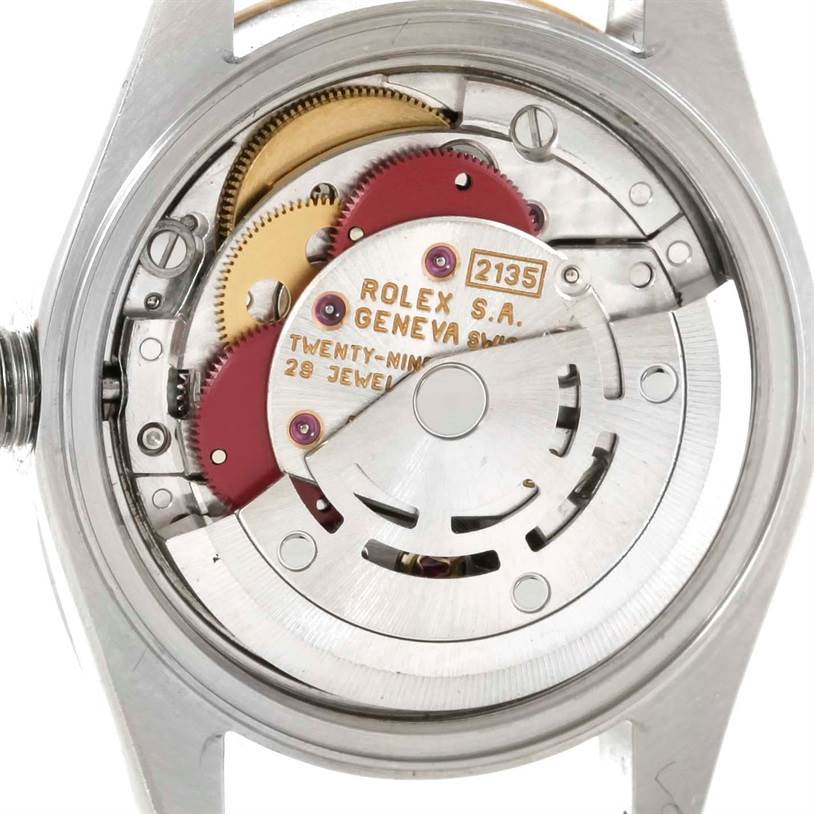 The image shows the rear view of a Rolex Datejust 69173 Women
s Stainless Steel Black Dial 69173 Women
s Stainless Steel Black Dial watch, revealing its internal mechanical movement.