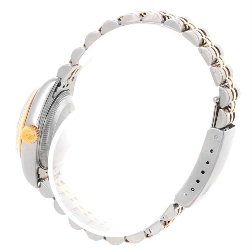 The image shows the right-side profile of a Rolex Datejust 69173 Women
s Stainless Steel Black Dial 69173 Women
s Stainless Steel Black Dial watch, highlighting part of the bezel, crown, and bracelet.