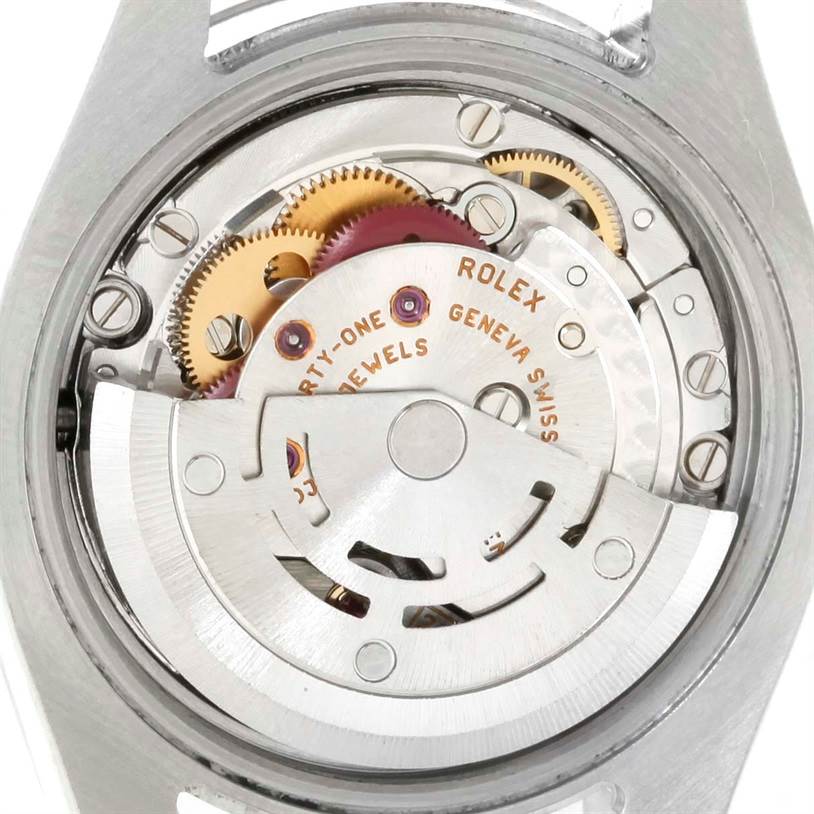 This image shows the internal mechanics of a Rolex Datejust 179174 Women
s Stainless Steel Silver Dial 179174 Women
s Stainless Steel Silver Dial watch, focusing on its movement parts and gears.