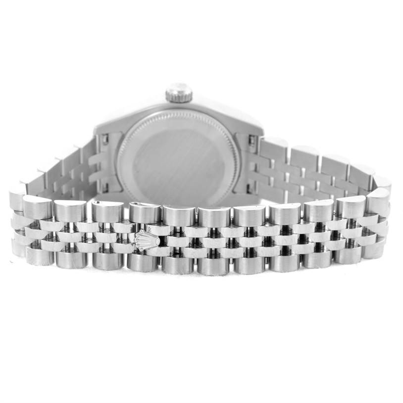 The image shows the back of a Rolex Datejust 179174 Women
s Stainless Steel Silver Dial 179174 Women
s Stainless Steel Silver Dial watch case and the Jubilee bracelet from a rear view angle.