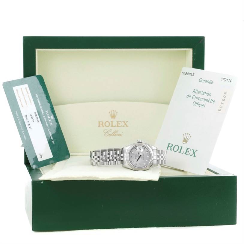 The image shows a Rolex Datejust 179174 Women
s Stainless Steel Silver Dial 179174 Women
s Stainless Steel Silver Dial watch in its open box, with accompanying Best Quality
ity and guarantee cards displayed.