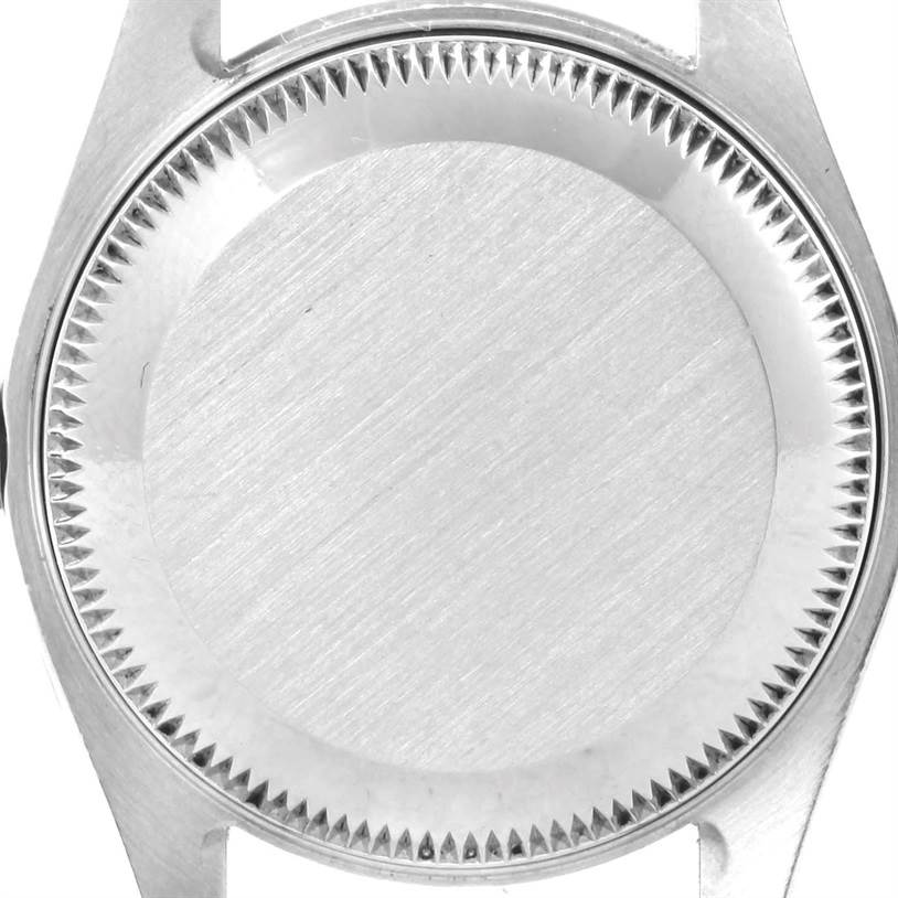 This image shows the case back of a Rolex Datejust 79174 Women
s Stainless Steel Silver Dial 79174 Women
s Stainless Steel Silver Dial watch from a top-down angle.