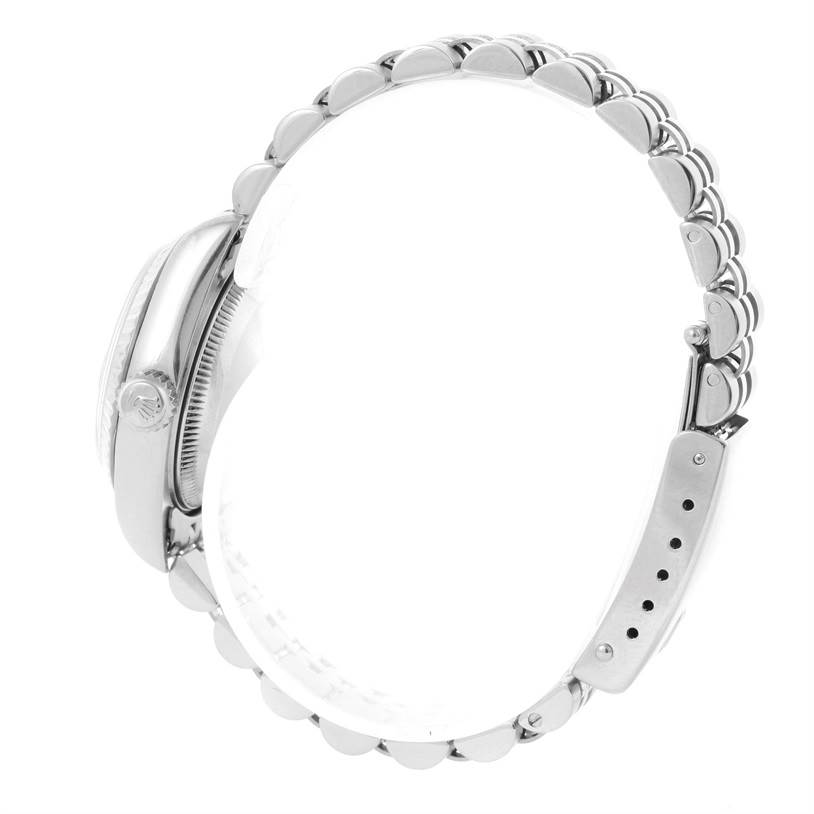 This image shows a Rolex Datejust 79174 Women
s Stainless Steel Silver Dial 79174 Women
s Stainless Steel Silver Dial watch from the side, highlighting the bracelet, clasp, and crown.