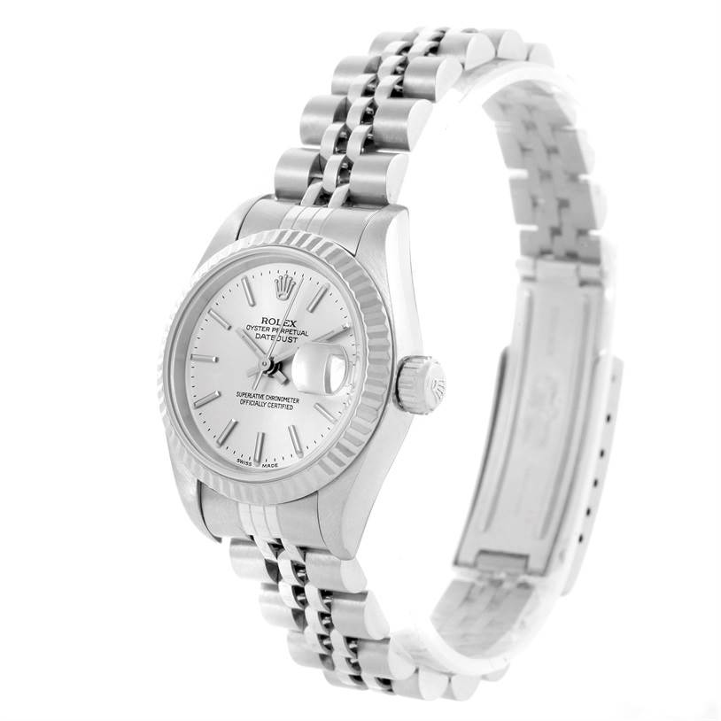 The image shows a Rolex Datejust 79174 Women
s Stainless Steel Silver Dial 79174 Women
s Stainless Steel Silver Dial watch from a slight side angle, highlighting its face, bezel, crown, and bracelet.