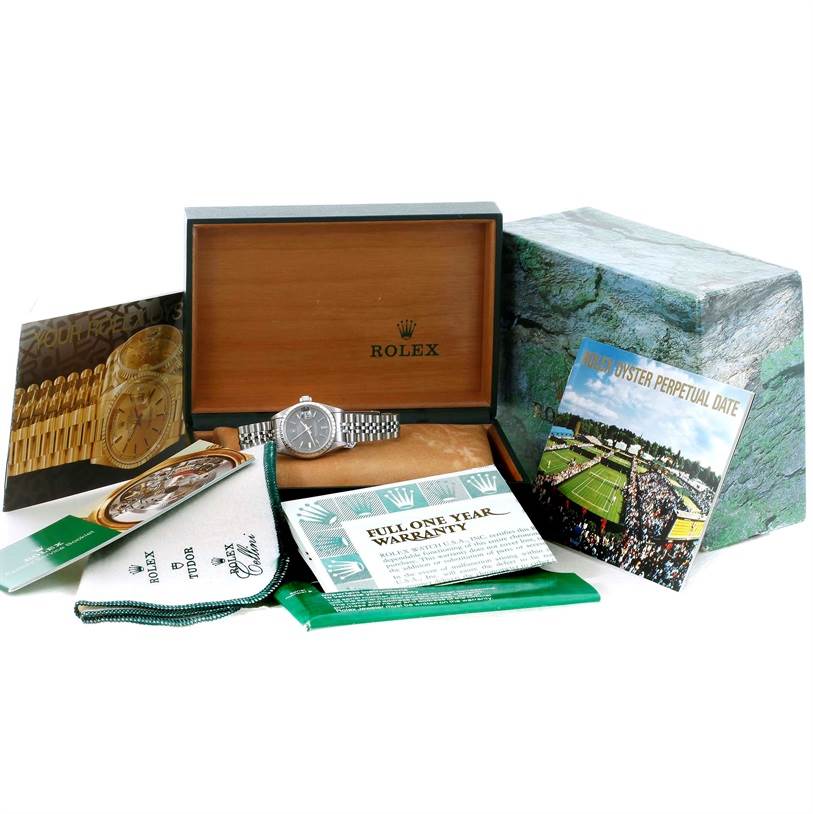 The image shows a Rolex Datejust 69240 Women's Stainless Steel Grey Dial 69240 Women's Stainless Steel Grey Dial watch with its original box, warranty, and various brochures.
