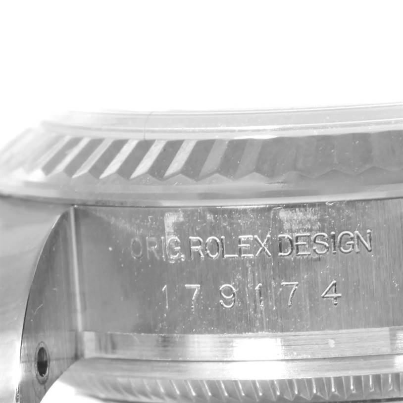 The image shows a close-up angle of the case side, bezel, and serial number of a Rolex Datejust 179174 Women's Stainless Steel White Dial 179174 Women's Stainless Steel White Dial watch.