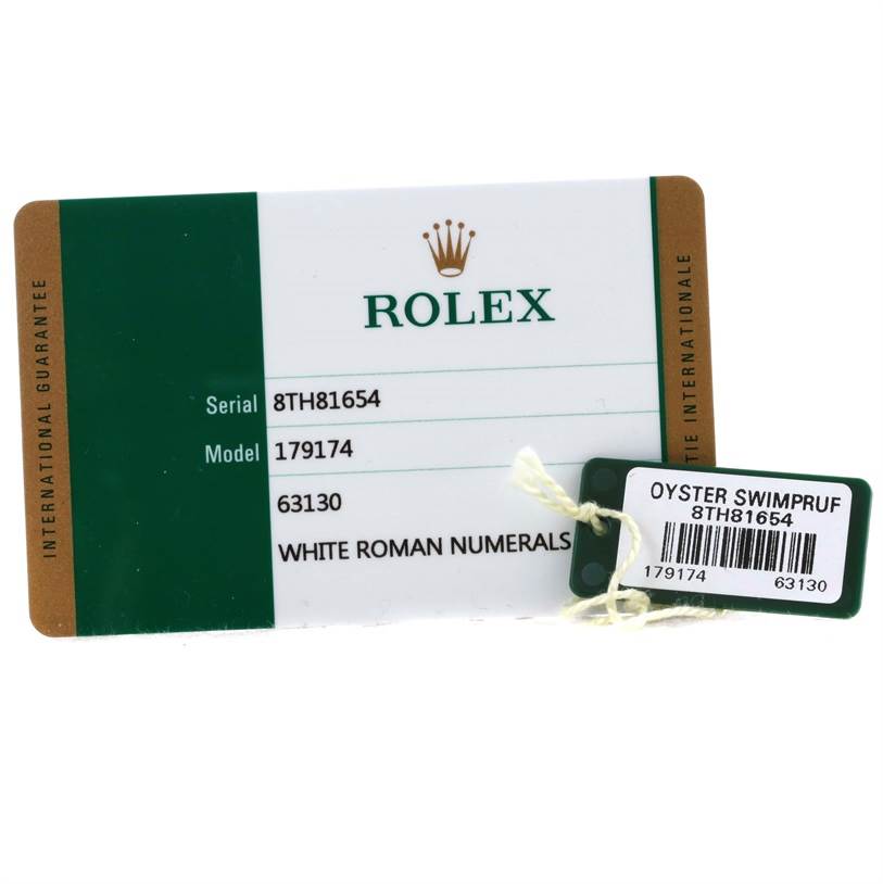 The image shows the warranty card and tags for a Rolex Datejust 179174 Women's Stainless Steel White Dial 179174 Women's Stainless Steel White Dial model 179174, displayed at an angle emphasizing the label.