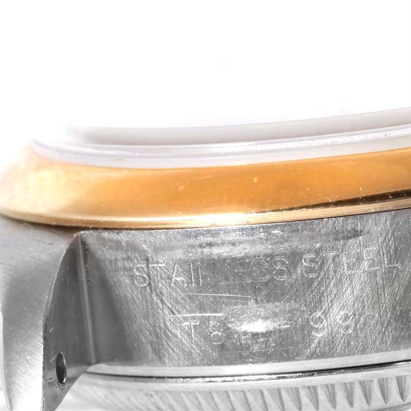 The image shows a close-up of the side and part of the bezel of a Datejust model by Rolex.