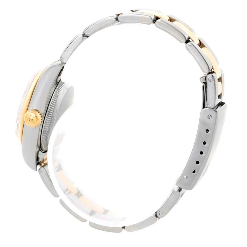 The Rolex Datejust 69163 Women's Stainless Steel White Dial 69163 Women's Stainless Steel White Dial watch is shown from a side angle, highlighting its bracelet, clasp, crown, and part of the case.