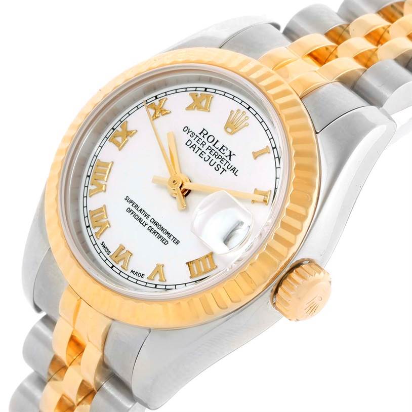 The image shows a Rolex Datejust 179173 Women's Steel and Gold (two tone) White Dial 179173 Women's Steel and Gold (two tone) White Dial watch at an angle highlighting its face, bezel, crown, and two-tone bracelet.