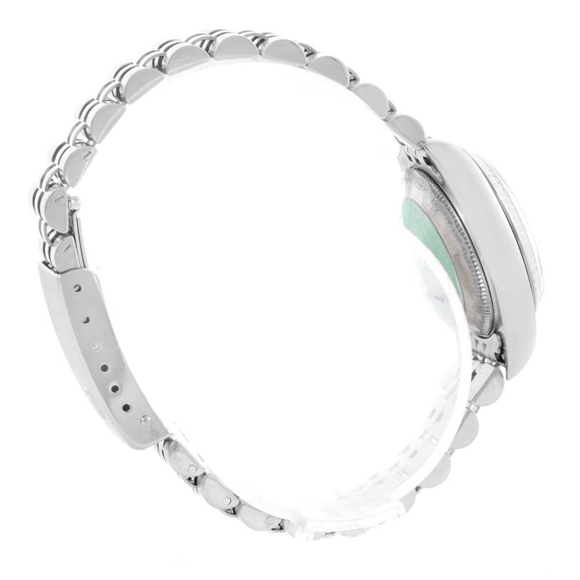 The image shows a side view of a Rolex Datejust 79174 Women's Stainless Steel Mother of Pearl Dial 79174 Women's Stainless Steel Mother of Pearl Dial watch, highlighting its bracelet and partially visible case.