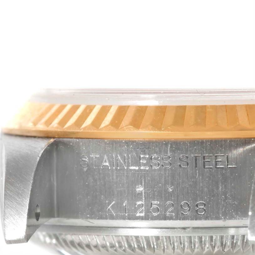 The image shows a close-up of the side casing, bezel, and engraved serial number of a Rolex Datejust 79163 Women's Steel and Gold (two tone) Pink Dial 79163 Women's Steel and Gold (two tone) Pink Dial watch.