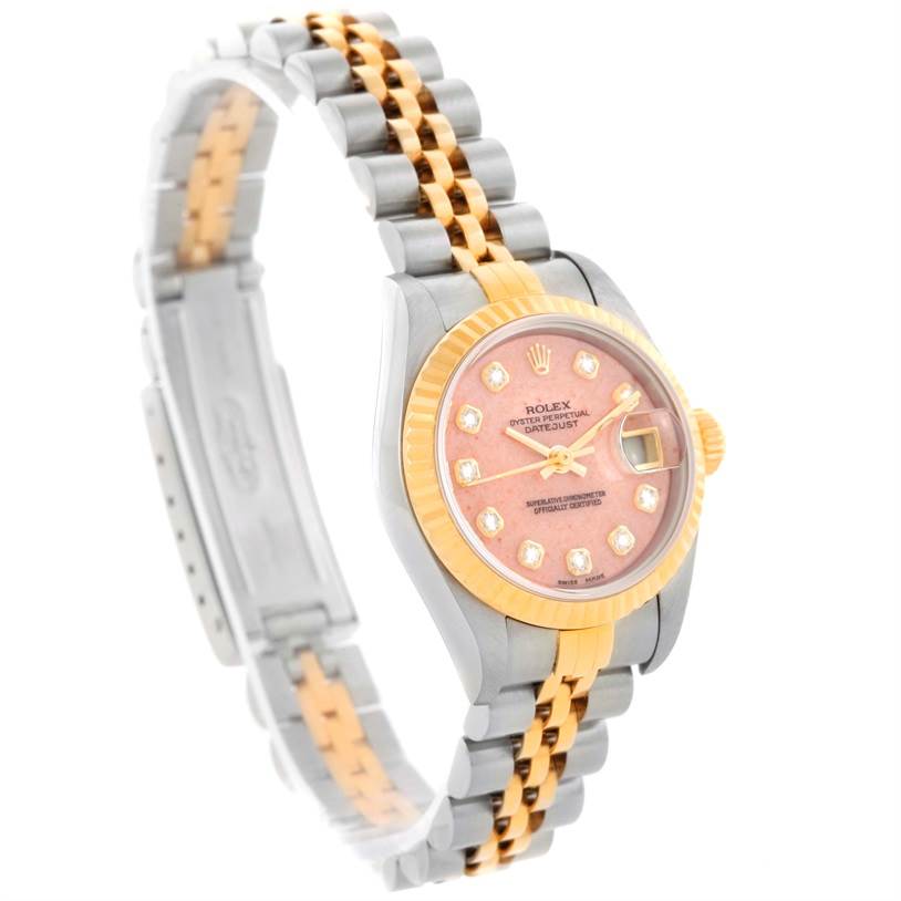 This image shows a Rolex Datejust 79163 Women's Steel and Gold (two tone) Pink Dial 79163 Women's Steel and Gold (two tone) Pink Dial watch from an angled side view, highlighting its pink dial, gold bezel, and two-tone bracelet.