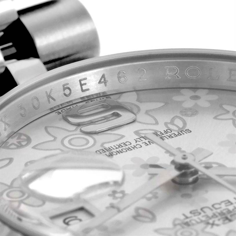 This image shows a close-up of the dial and engraved rehaut of a Rolex Datejust 116234 Stainless Steel Silver Dial 116234 Stainless Steel Silver Dial watch.