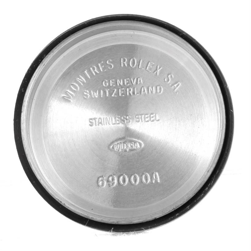 This is the inside of the stainless steel case back of a Rolex Datejust 69173 Women's Stainless Steel Champagne Dial 69173 Women's Stainless Steel Champagne Dial model, displaying text engraving.