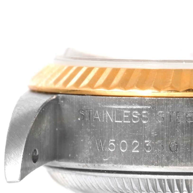 This image shows a close-up angle of the case side, bezel, and part of the serial number of a Rolex Datejust 69173 Women's Stainless Steel Champagne Dial 69173 Women's Stainless Steel Champagne Dial watch.