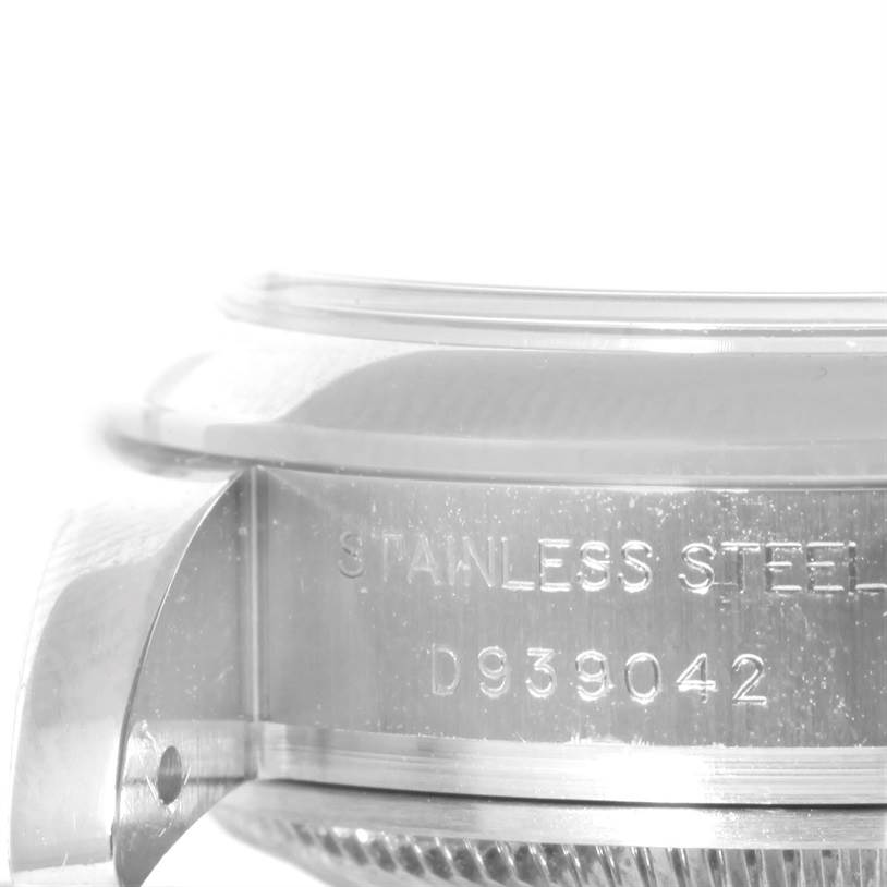 The image shows a close-up of the serial number engraving on the side of the case of a Rolex Datejust 179160 Women's Stainless Steel White Dial 179160 Women's Stainless Steel White Dial watch in stainless steel.