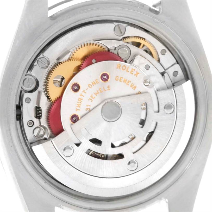The image shows the internal mechanism of a Rolex Datejust 179174 Women's Stainless Steel Silver Dial 179174 Women's Stainless Steel Silver Dial watch viewed from the back, highlighting gears and components.