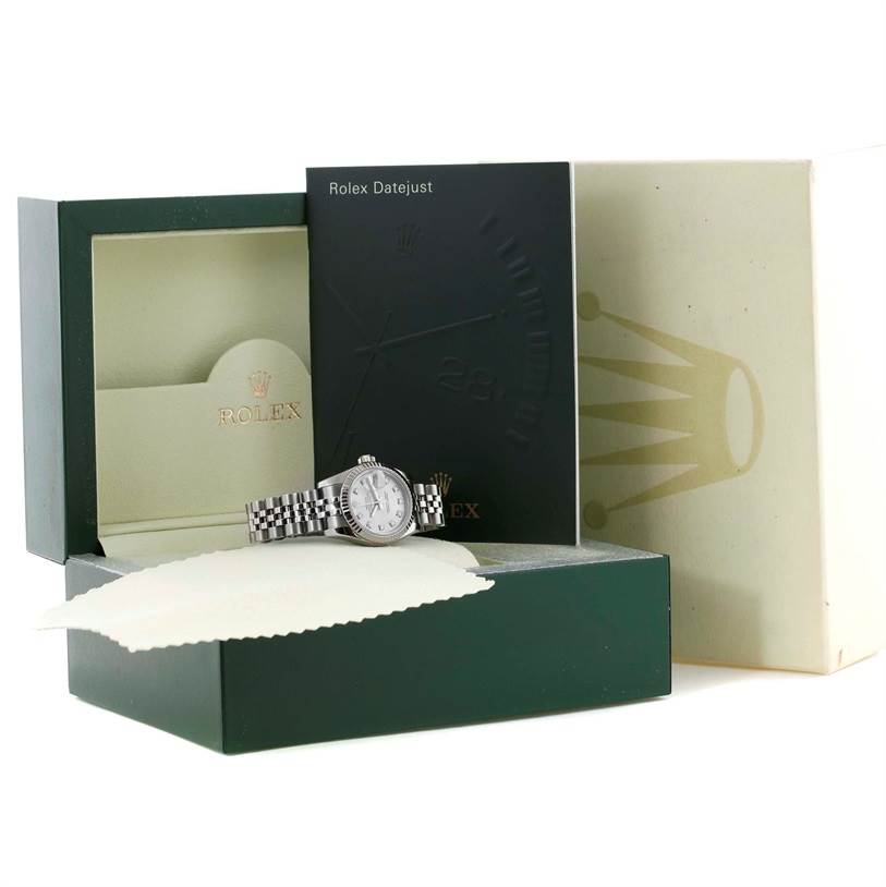 The image shows a Rolex Datejust 179174 Women's Stainless Steel Silver Dial 179174 Women's Stainless Steel Silver Dial watch, its box, and the accompanying manual and cloth from a front angle.