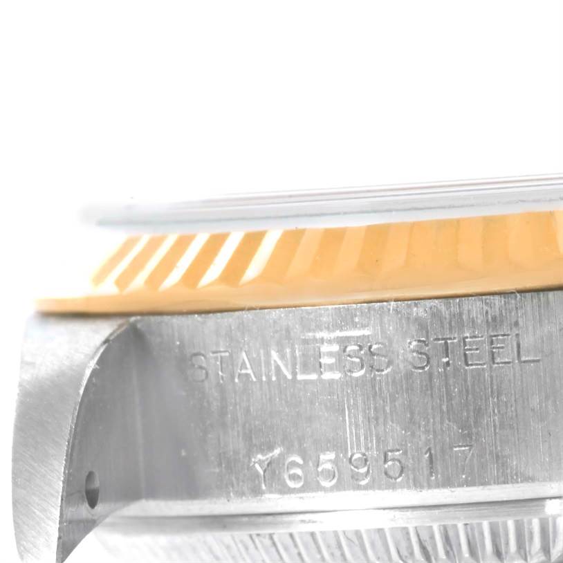 This image shows a close-up of the stainless steel side case and fluted bezel on a Rolex Datejust 79173 Women's Stainless Steel Blue Dial 79173 Women's Stainless Steel Blue Dial watch.