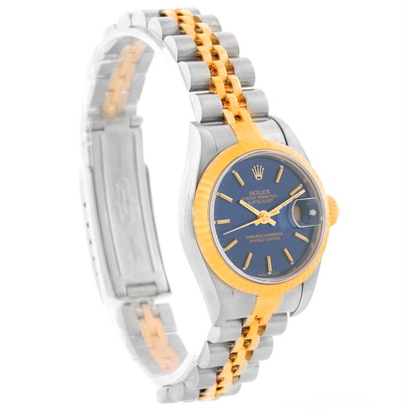 The Rolex Datejust 79173 Women's Stainless Steel Blue Dial 79173 Women's Stainless Steel Blue Dial watch is shown at an angle displaying the face, fluted bezel, crown, and two-tone metal bracelet.