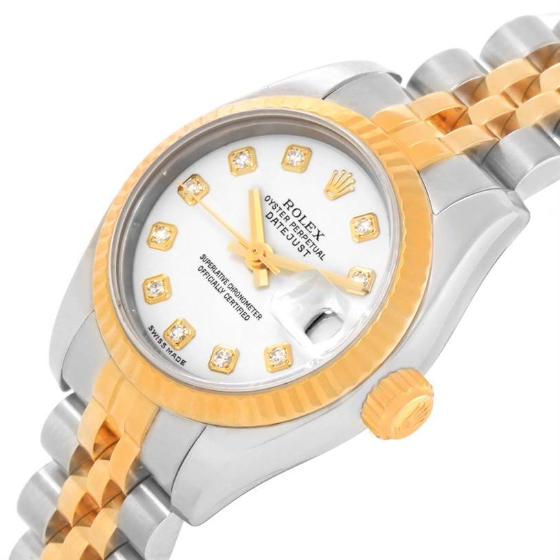 This image shows a close-up, angled view of a Rolex Datejust 179173 Women's Steel and Gold (two tone) White Dial 179173 Women's Steel and Gold (two tone) White Dial watch face, bezel, and part of the bracelet.