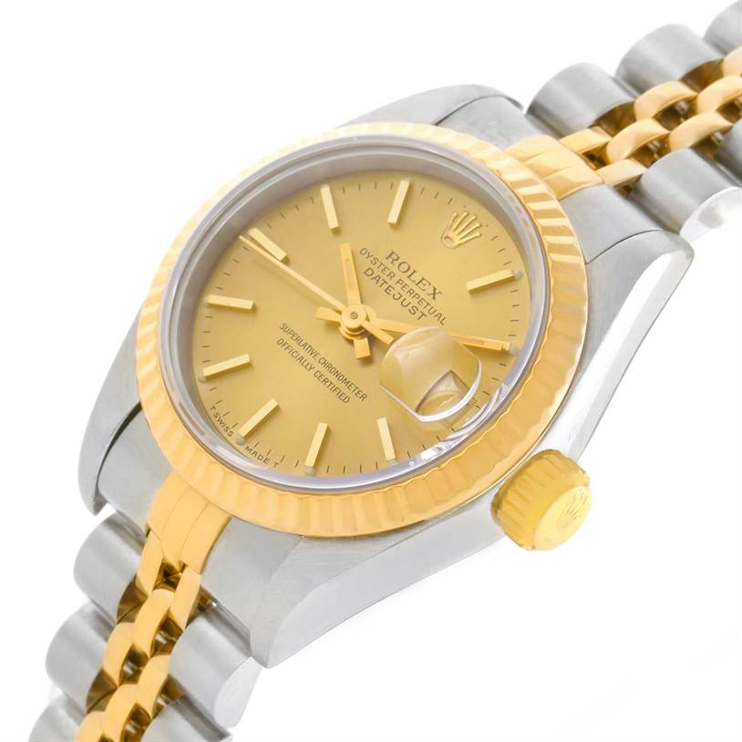 The image shows a close-up side angle of the Rolex Datejust 69173 Women's Stainless Steel Champagne Dial 69173 Women's Stainless Steel Champagne Dial watch, highlighting the face, dial, fluted bezel, crown, and part of the Jubilee bracelet.