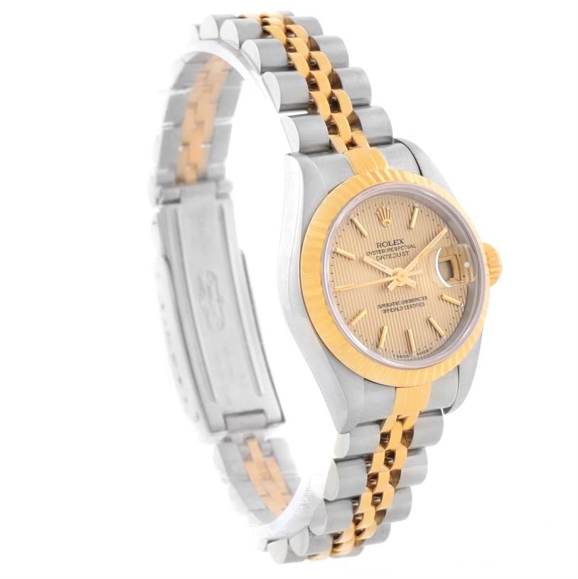 The Rolex Datejust 69173 Women's Stainless Steel Champagne Dial 69173 Women's Stainless Steel Champagne Dial watch is shown from a side angle, highlighting its gold and silver bracelet and fluted bezel.