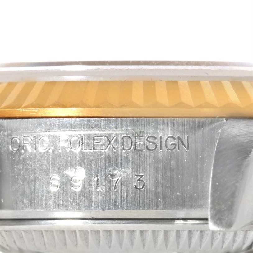 This image shows a close-up side view of the bezel and casing of a Rolex Datejust 69173 Women's Stainless Steel Champagne Dial 69173 Women's Stainless Steel Champagne Dial watch, highlighting the engraved model number.