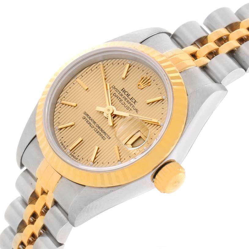 This image shows a close-up angled view of the Rolex Datejust 69173 Women's Stainless Steel Champagne Dial 69173 Women's Stainless Steel Champagne Dial watch, highlighting the gold dial, bezel, and part of the two-tone bracelet.