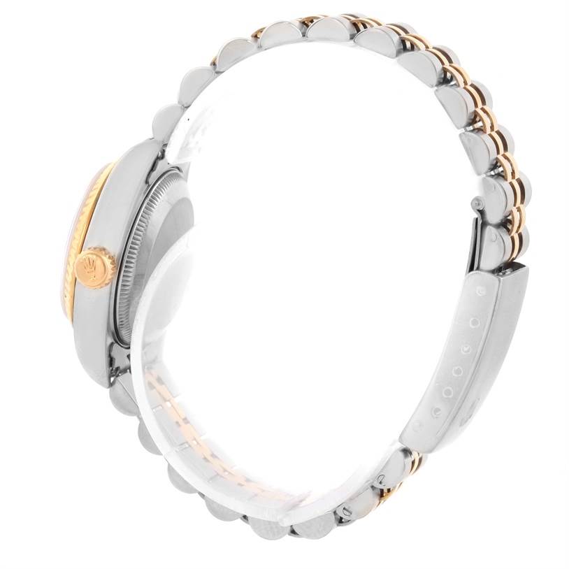 The image shows a side view of a Rolex Datejust 69173 Women's Stainless Steel Champagne Dial 69173 Women's Stainless Steel Champagne Dial watch emphasizing the crown, case, and part of the bracelet.