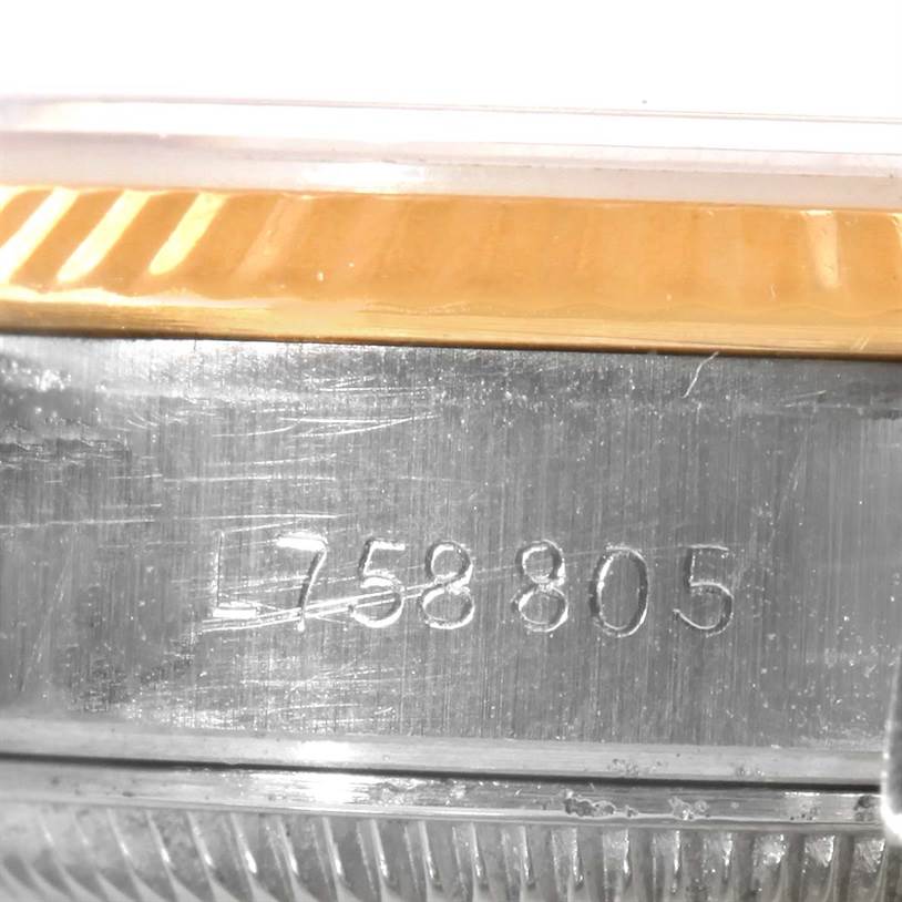 The close-up image shows the serial number engraved on the case of a Rolex Datejust 69173 Women
s Stainless Steel Blue Dial 69173 Women
s Stainless Steel Blue Dial watch.