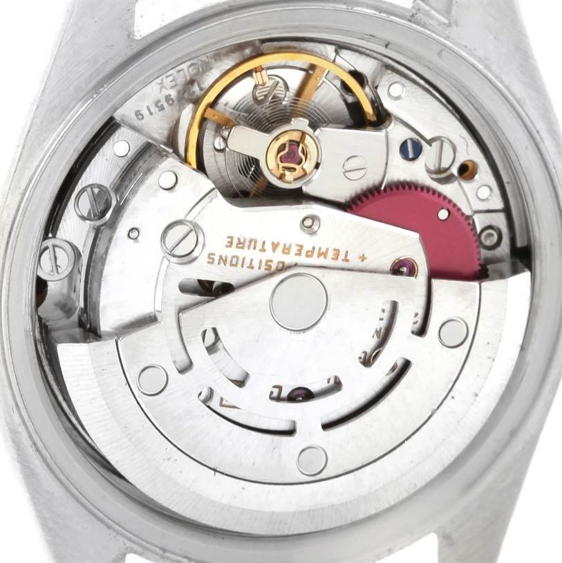 This image shows the intricate movement and internal components of a Rolex Datejust 69173 Women
s Stainless Steel Blue Dial 69173 Women
s Stainless Steel Blue Dial watch from a close-up angle.