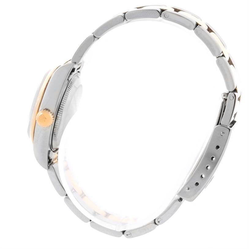 The image shows a side view of the Rolex Datejust 79163 Women
s Steel and Gold (two tone) Blue Dial 79163 Women
s Steel and Gold (two tone) Blue Dial watch, focusing on the crown, case, and bracelet.