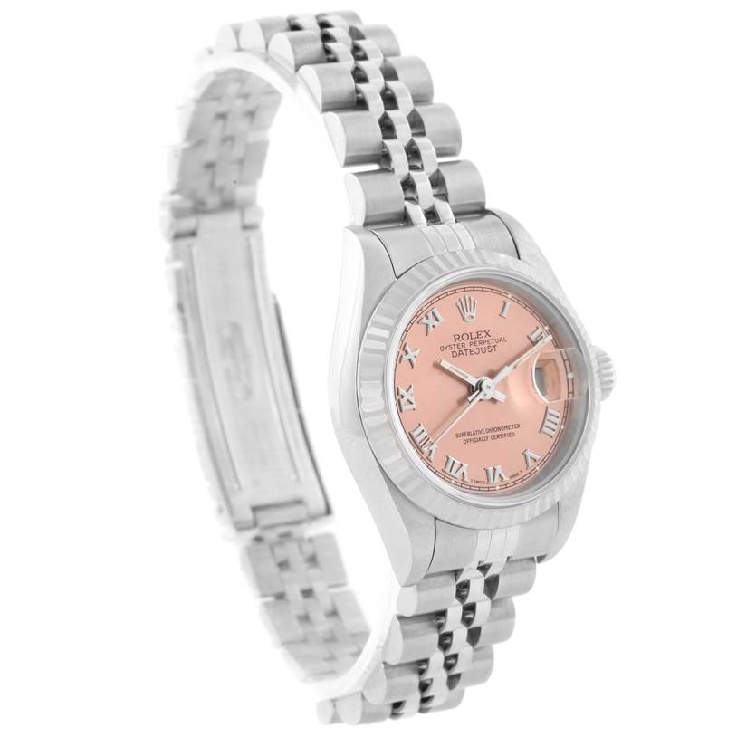 The image shows a side angle of a Rolex Datejust 69174 Women
s Stainless Steel Pink Dial 69174 Women
s Stainless Steel Pink Dial, highlighting its pink dial, fluted bezel, and Jubilee bracelet.