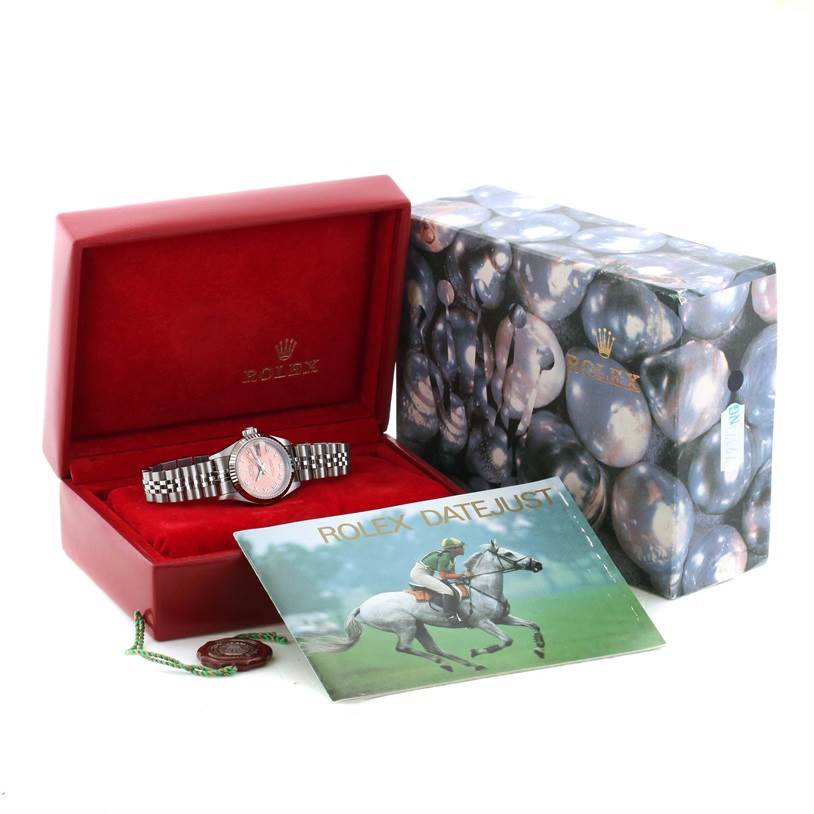 This image shows a Rolex Datejust 69174 Women
s Stainless Steel Pink Dial 69174 Women
s Stainless Steel Pink Dial watch in its open red case, with a booklet and decorative box included.