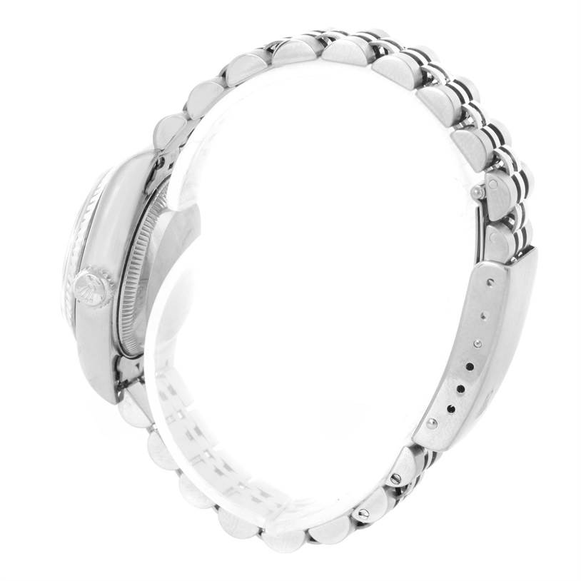 This side angle view of the Rolex Datejust 79174 Women
s Stainless Steel Mother of Pearl Dial 79174 Women
s Stainless Steel Mother of Pearl Dial watch showcases the case, bezel, crown, and bracelet.