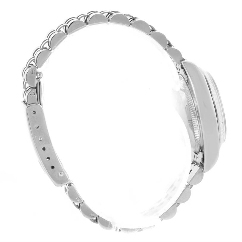 This side-view image of a Rolex Datejust 79174 Women
s Stainless Steel Mother of Pearl Dial 79174 Women
s Stainless Steel Mother of Pearl Dial watch shows the bracelet and the side profile of the case.