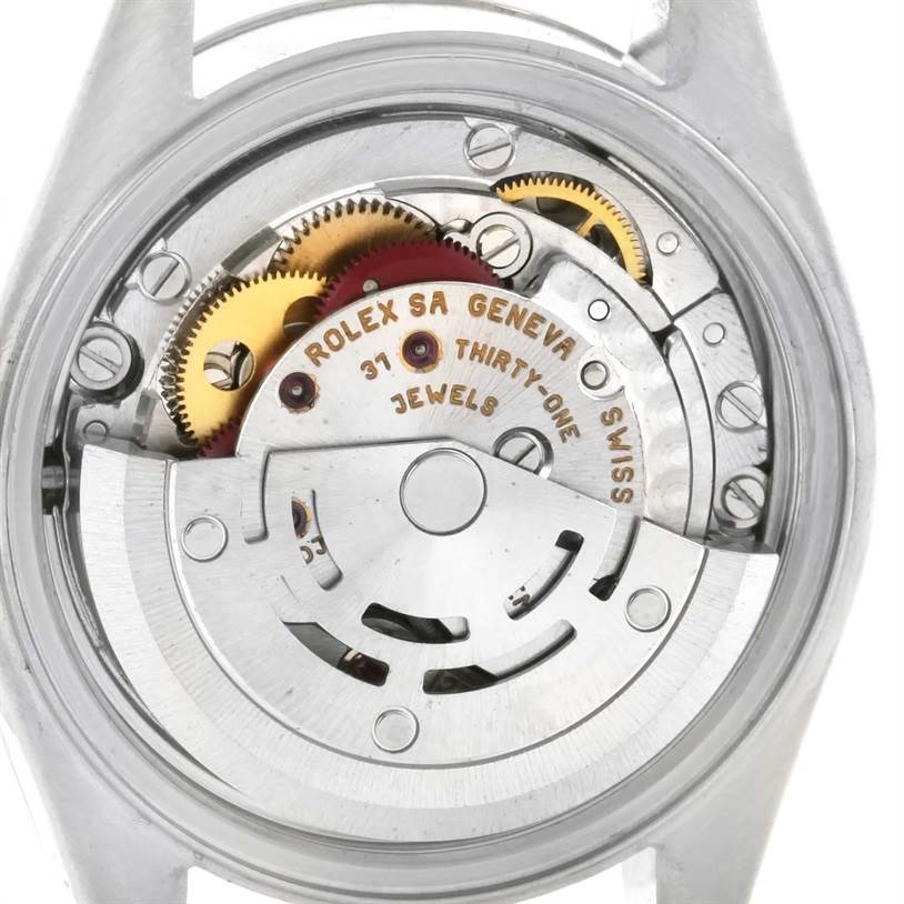 This is an internal view of the Rolex Datejust 79174 Women
s Stainless Steel Mother of Pearl Dial 79174 Women
s Stainless Steel Mother of Pearl Dial watch, showing the movement and gears.