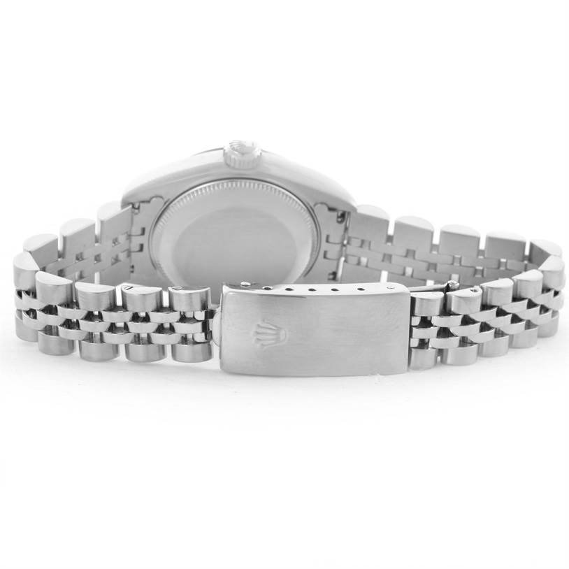 The image shows the back view of a Rolex Datejust 69174 Women
s Stainless Steel Black Dial 69174 Women
s Stainless Steel Black Dial watch, highlighting the case back and Jubilee bracelet with the clasp.