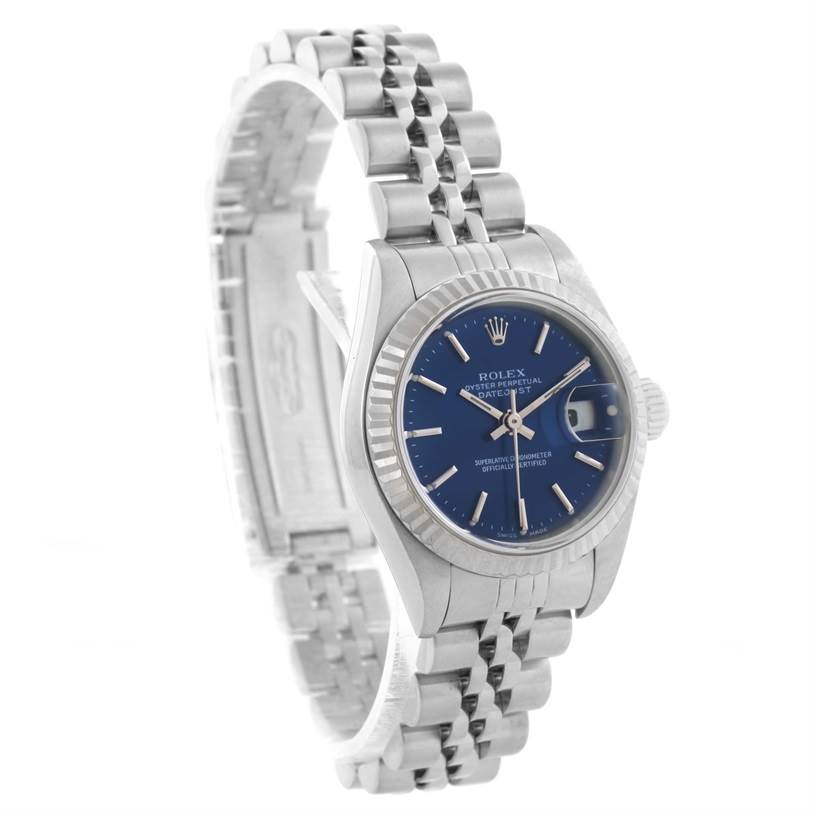 The image shows the Rolex Datejust 79174 Women
s Stainless Steel Blue Dial 79174 Women
s Stainless Steel Blue Dial watch from a side angle, displaying the face, bezel, crown, and bracelet.
